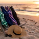 Serene beach setting at sunset with golden light reflecting off water
